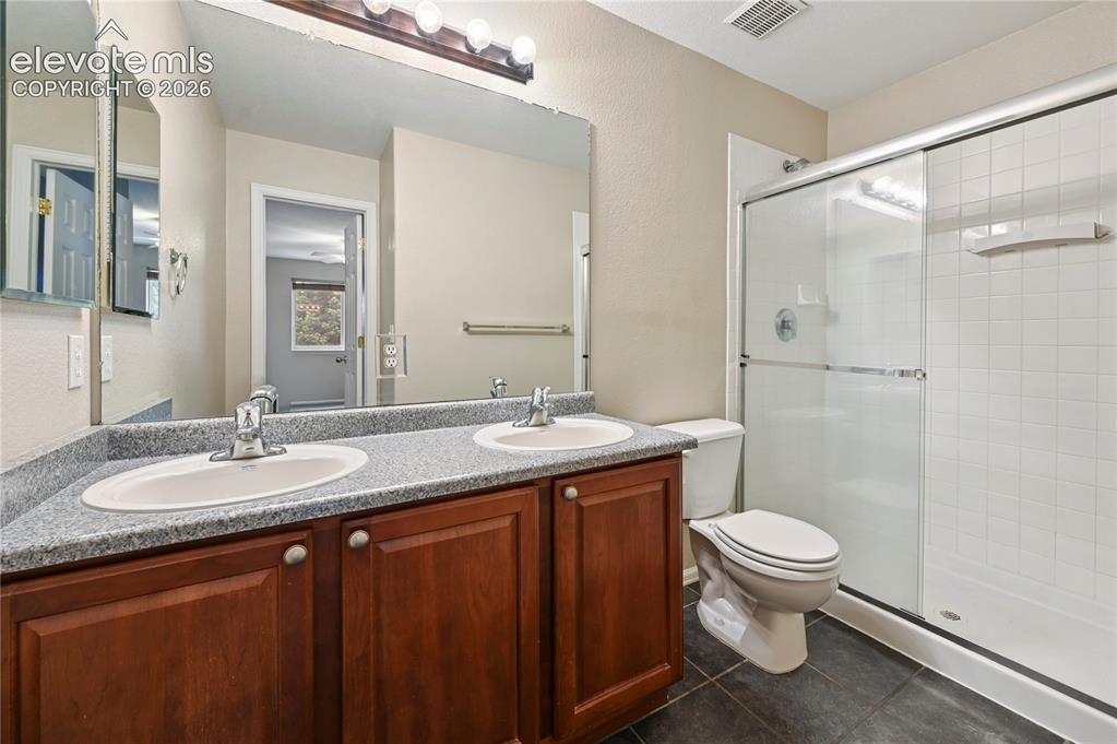 Image 14 of 29: The 3/4 bathroom off the owner