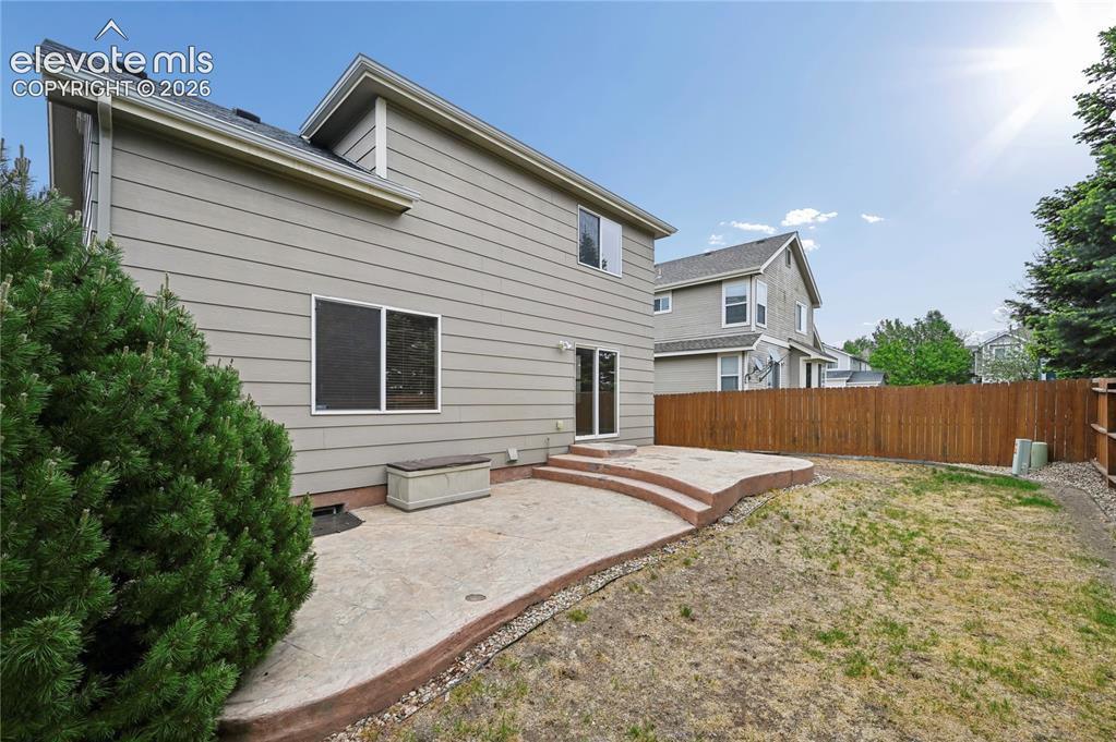 Image 22 of 29: The two-tiered back patio has a natural gas hookup for your grill or smoker