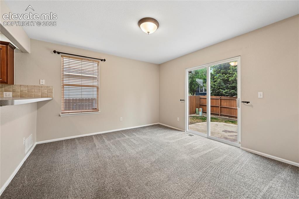 Image 5 of 29: The dining area has plenty of room for a good-sized table, and the south-fa