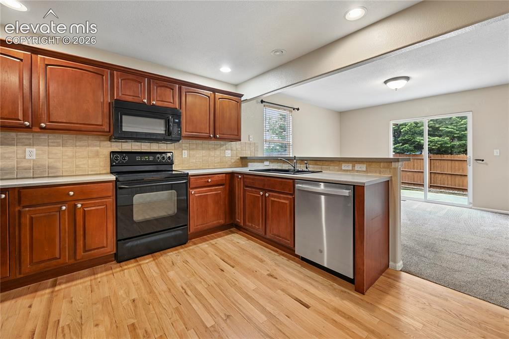 Image 8 of 29: Refinished solid-oak hardwood floors beat the cheap trend of various plasti
