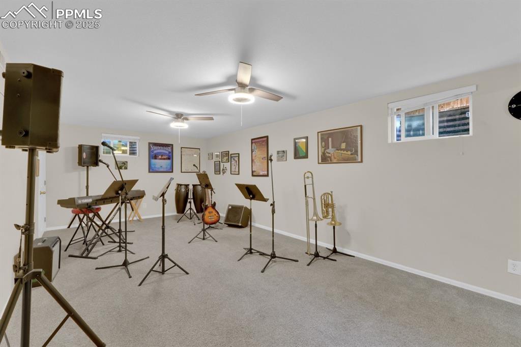 Image 24 of 47: Workout room featuring carpet flooring and baseboards