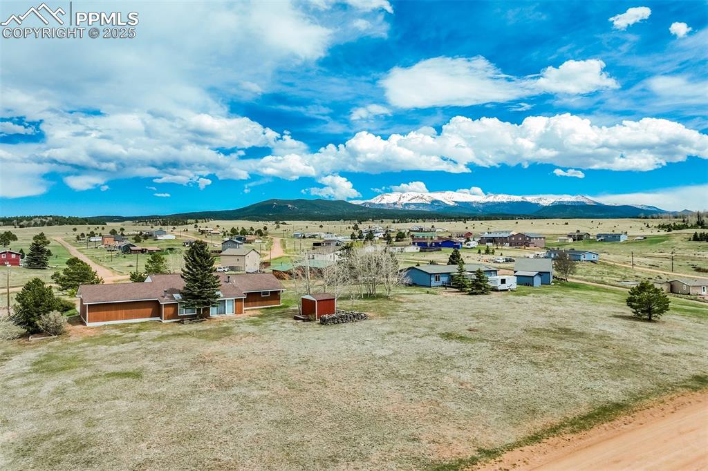 Image 43 of 43: Back of the house with Pikes Peak backdrop