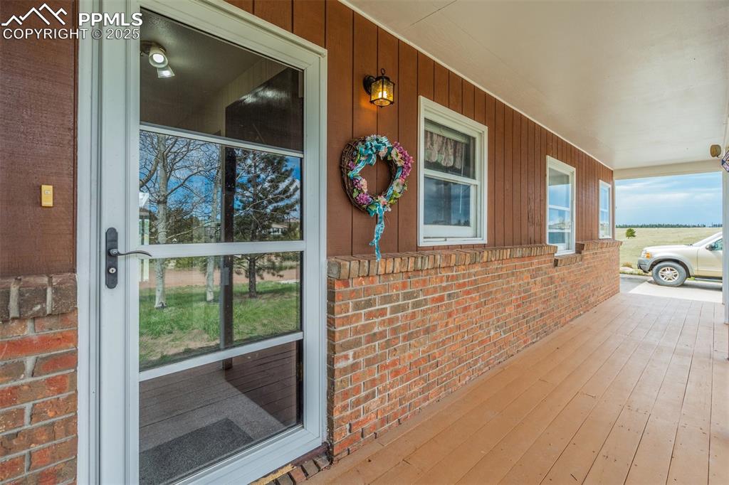 Image 6 of 43: Front deck with views of Pikes Peak