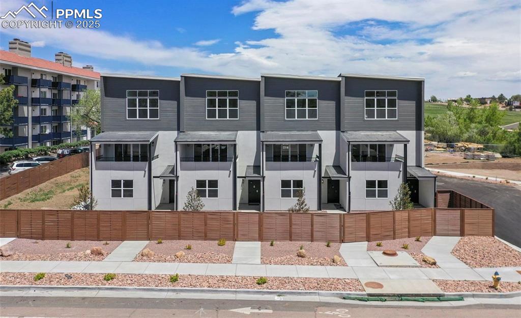 Image 1 of 31: View of front of property featuring a fenced yard