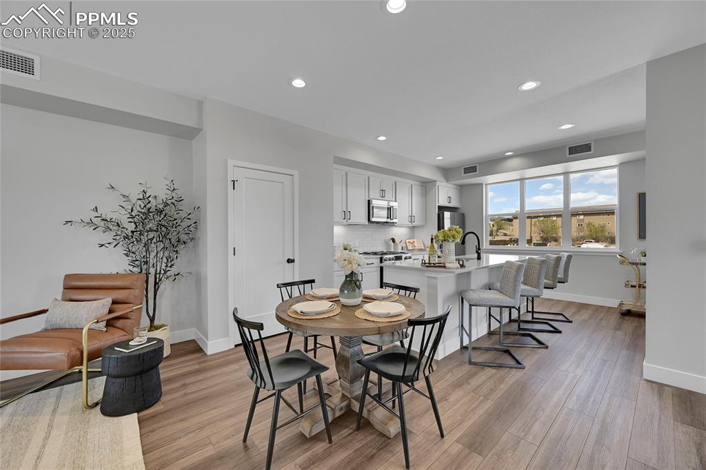 Image 13 of 31: Dining area with recessed lighting