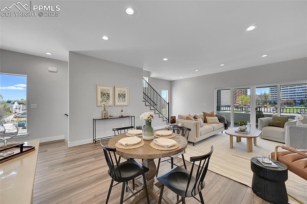 Image 15 of 31: Dining space featuring recessed lighting, stairway, and light wood-type flo