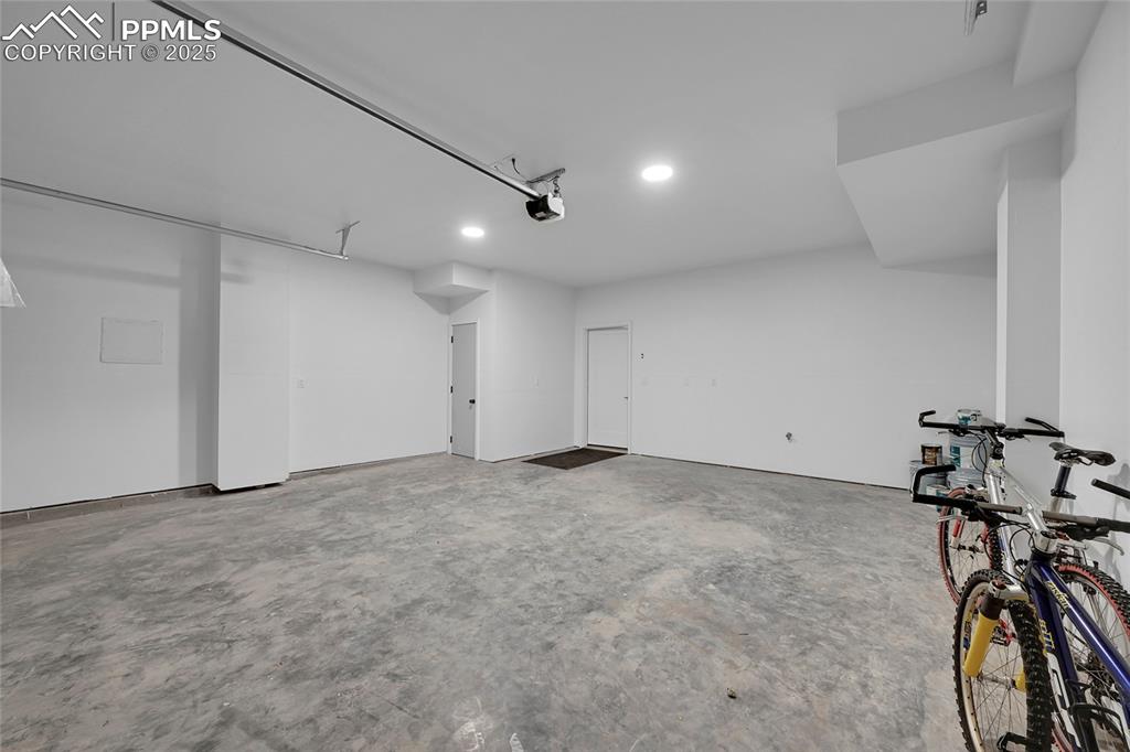 Image 29 of 31: Garage with a garage door opener