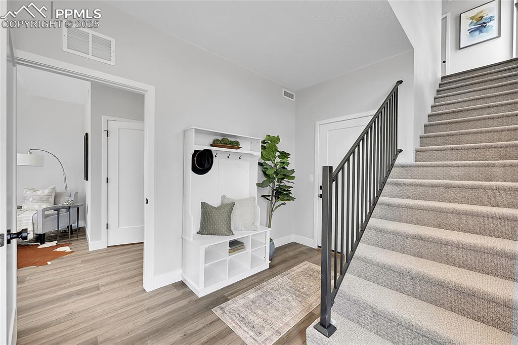 Image 4 of 31: Stairway and wood finished floors