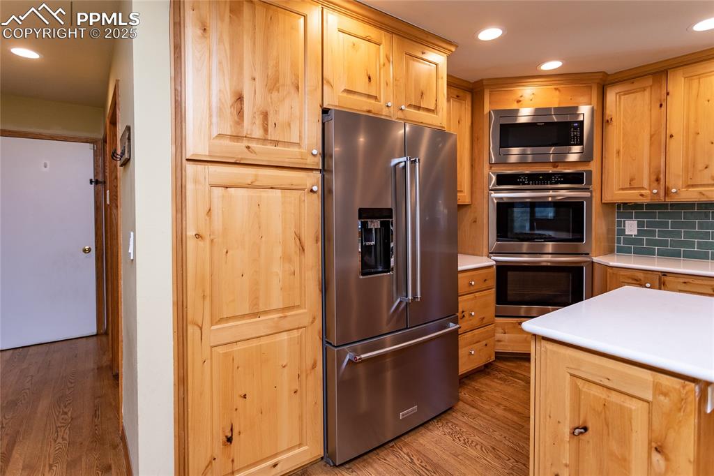 Image 16 of 50: Pantry next to the refrigerator