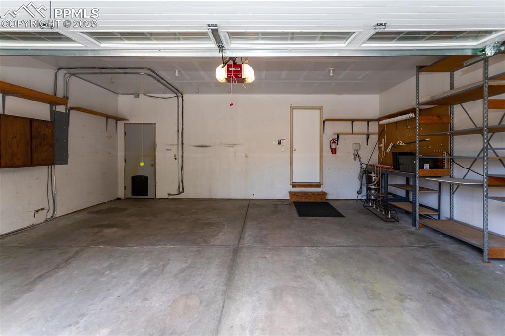 Image 46 of 50: Shelving included in the garage