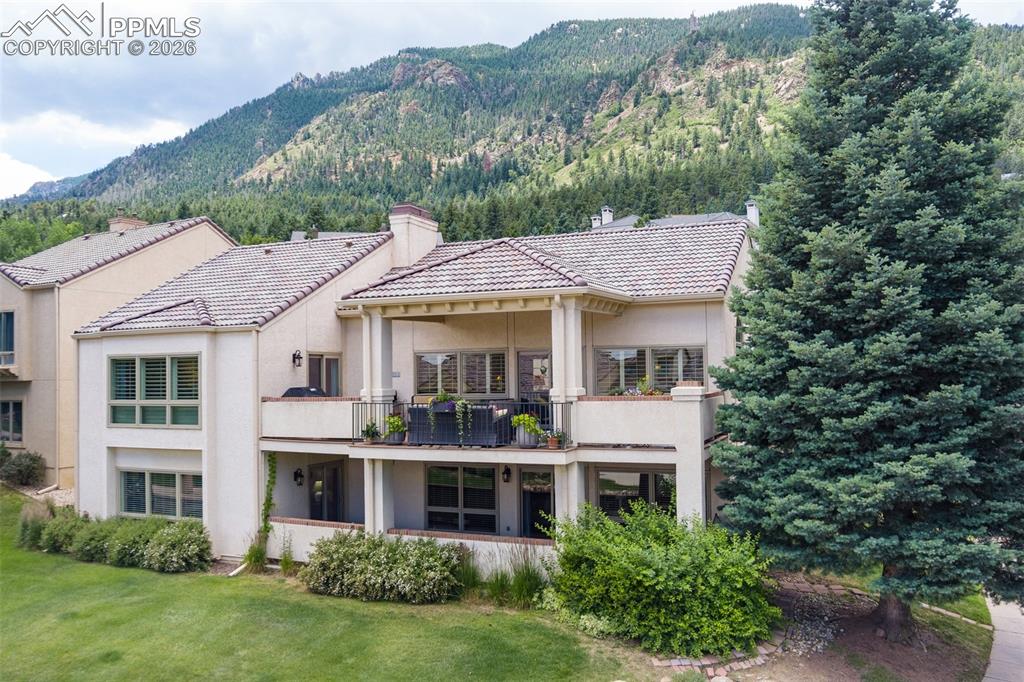 Image 11 of 50: RELAX and enjoy the beautiful surroundings on the upper level patio accessi