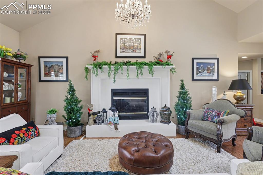 Image 15 of 50: The gas fireplace adds a cozy feel to this elegant room.
