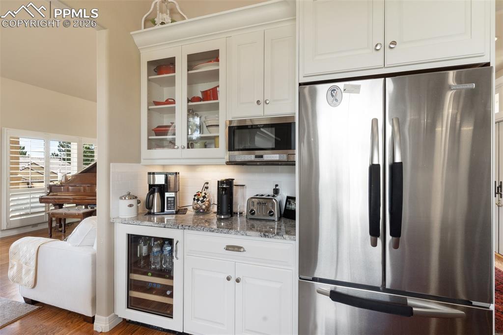 Image 17 of 50: Unwind and savor the moment in this refined living space, perfectly complem