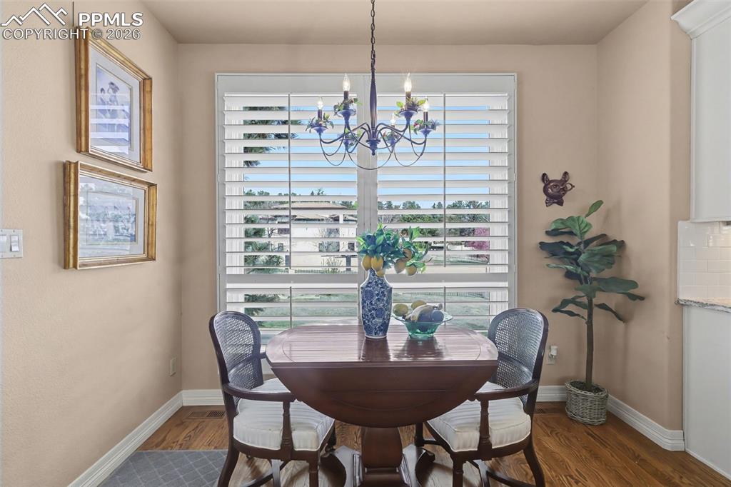 Image 22 of 50: Informal dining area makes for a great place to grab a snack.
