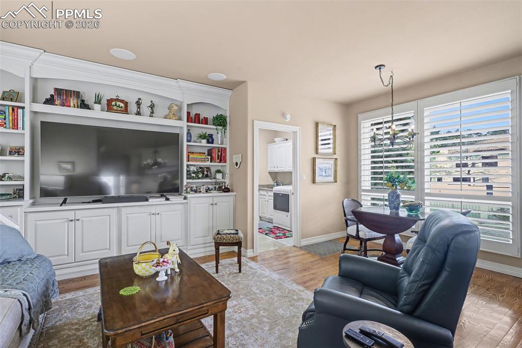 Image 24 of 50: Your family and friends will love gathering in the inviting hearth room, a