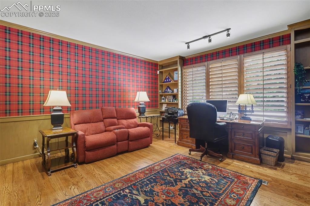 Image 27 of 50: Your family and friends will love gathering in the inviting hearth room, a 