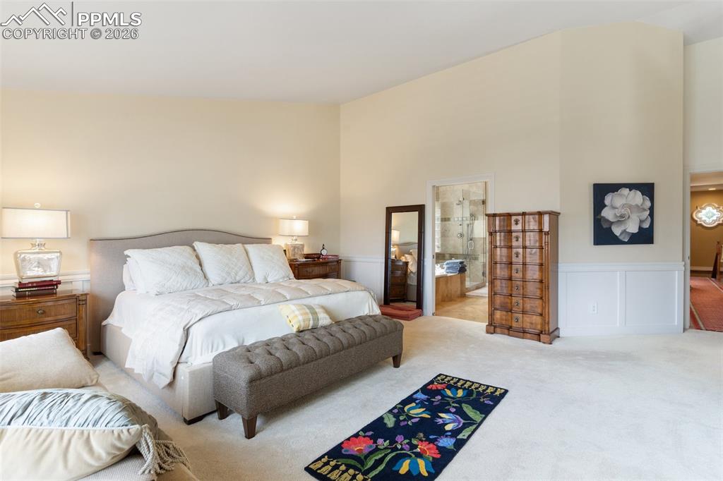Image 33 of 50: Master bedroom with view of en suite bath.