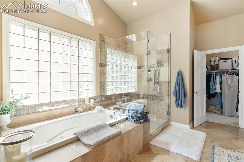Image 35 of 50: YES, there is a jacuzzi tub, oversized shower and lots of light!