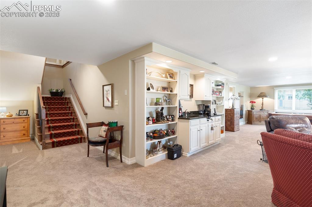 Image 37 of 50: This spacious primary bath features an oversized walk-in closet, double sin