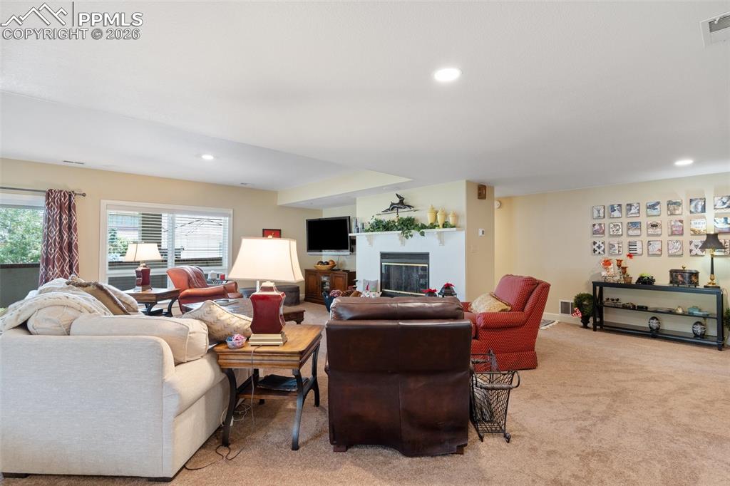 Image 39 of 50: Cozy sitting area at the top of the stairs to the basement.
