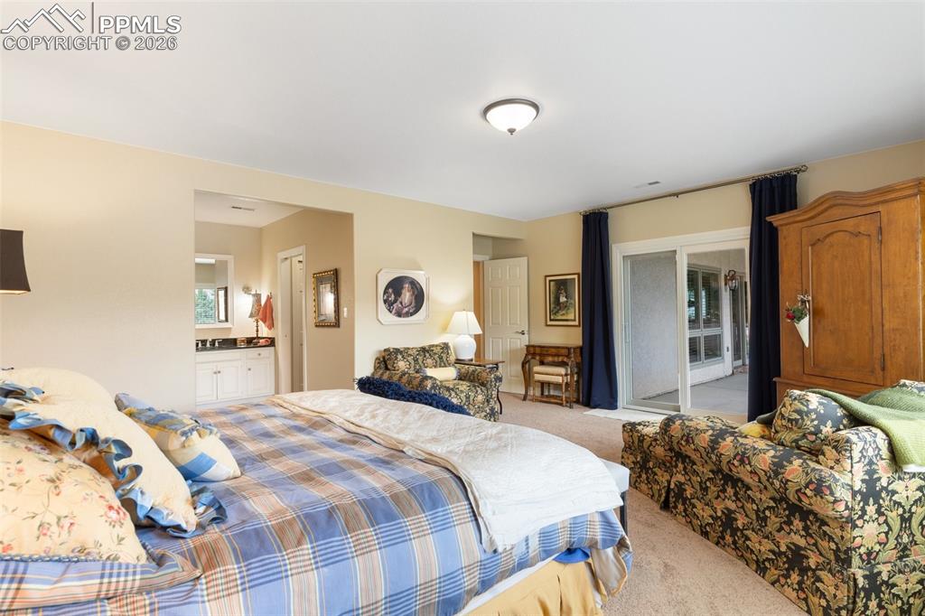 Image 43 of 50: Basement bedroom 4 boasts access to the lower level patio. The adjacent ful