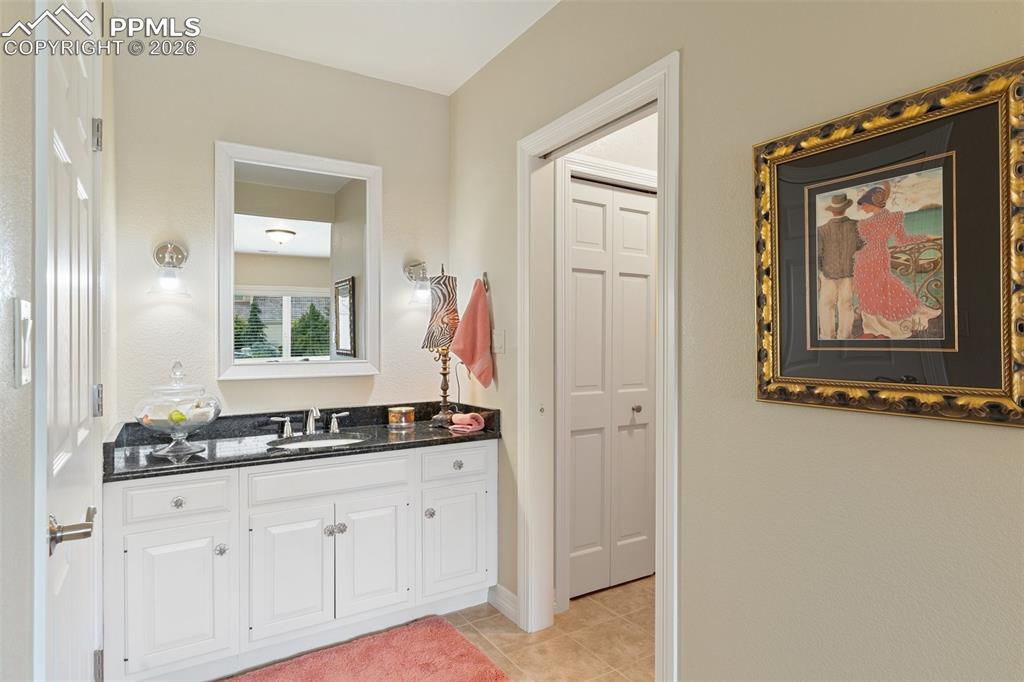 Image 44 of 50: Full bath en suite for basement bedroom 4.