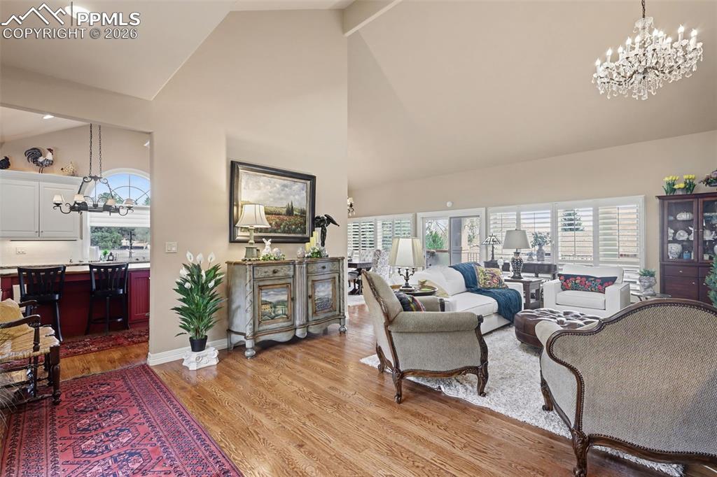 Image 5 of 50: Soaring ceilings and a wall of windows make this a special room to enjoy.