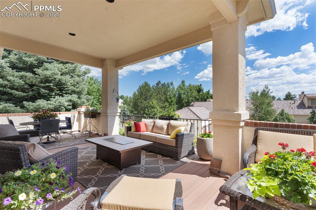 Image 8 of 50: RELAX and enjoy the beautiful surroundings on the upper level patio accessi