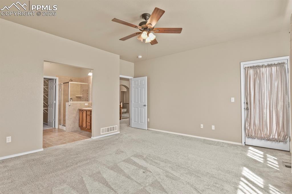 Image 17 of 42: Main floor Primary Bedroom with a private walkout to the balcony