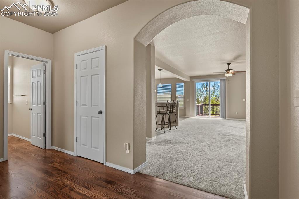 Image 4 of 42: Entry opens to the living room, with an office and half bath on the left