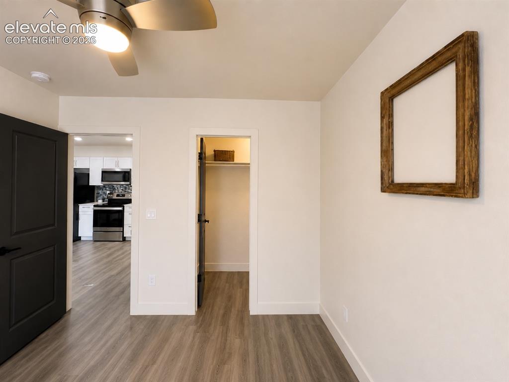 Image 12 of 46: ADU Bedroom with walk in closet and LVP