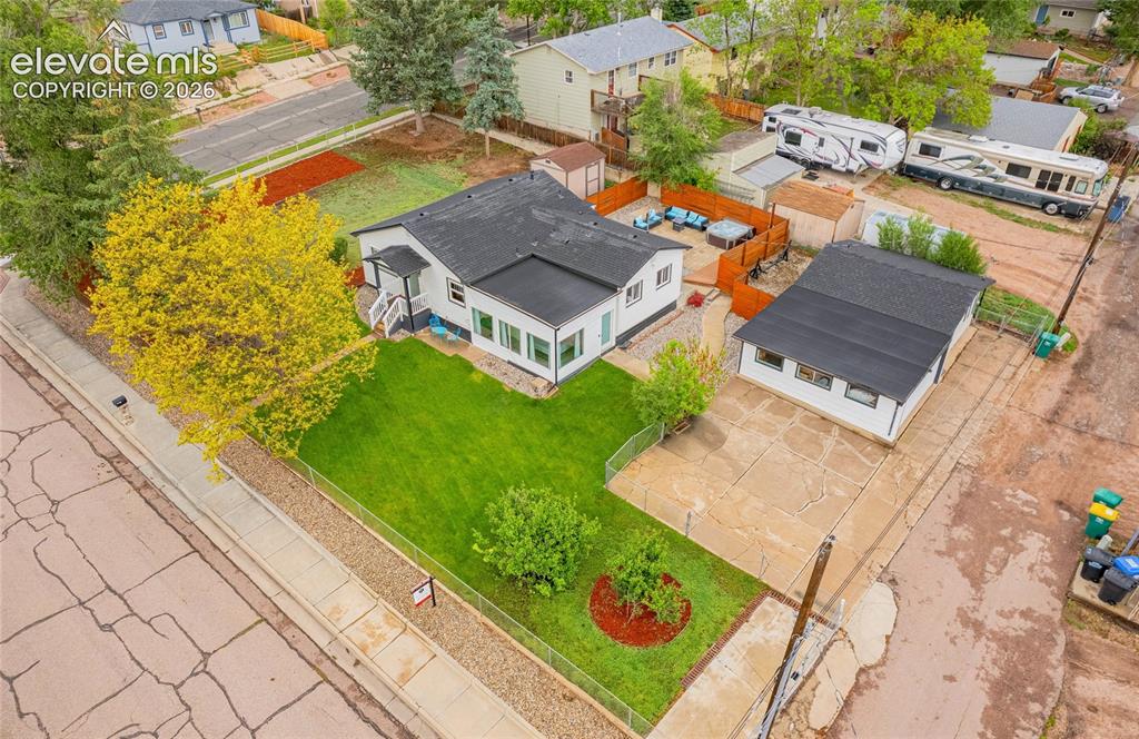 Image 45 of 46: Expansive lot featuring a primary residence, detached auxiliary building, c