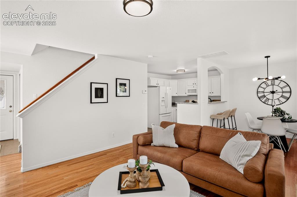 Image 10 of 35: Open floor plan with kitchen / dining / living room on main level.