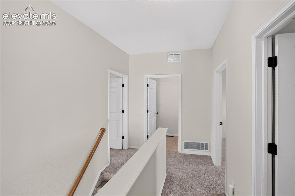 Image 15 of 35: Upper level landing and hallway. 