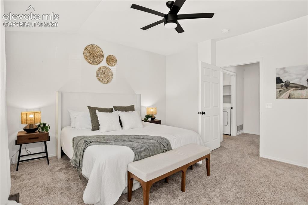 Image 16 of 35: Primary (master) bedroom with ceiling fan and mountain views. Conveniently