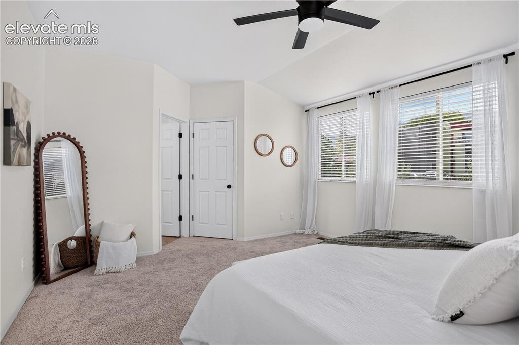 Image 17 of 35: Primary (master) bedroom with ceiling fan.