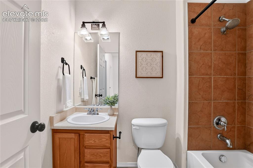 Image 23 of 35: Full bathroom in upper hallway. 