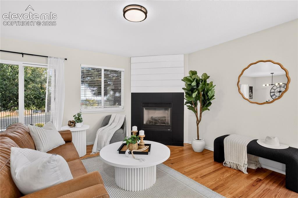 Image 3 of 35: Living room with gas fireplace and walk out to back yard. 