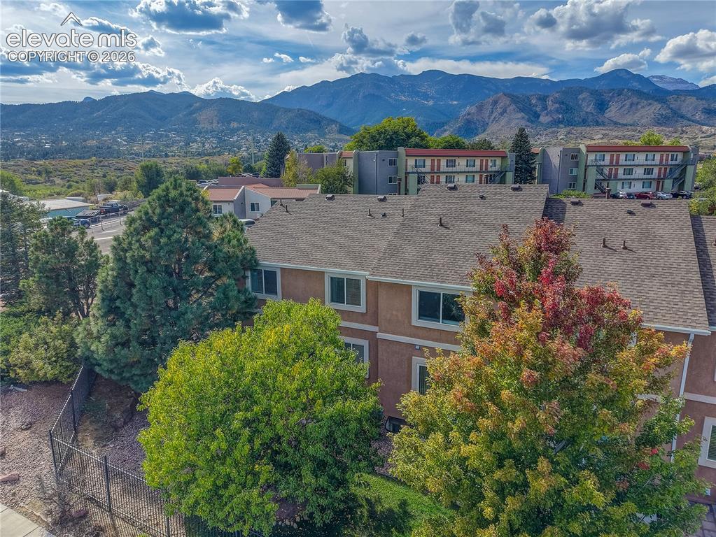 Image 34 of 35: Aerial view of townhome with mountain views.