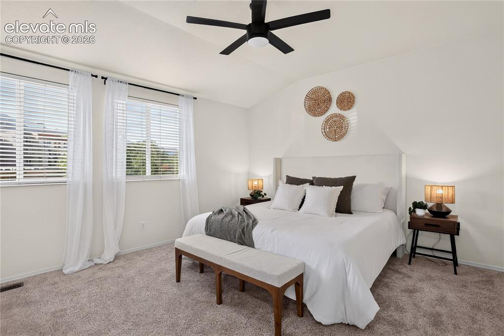 Image 5 of 35: Primary (master) bedroom with ceiling fan.
