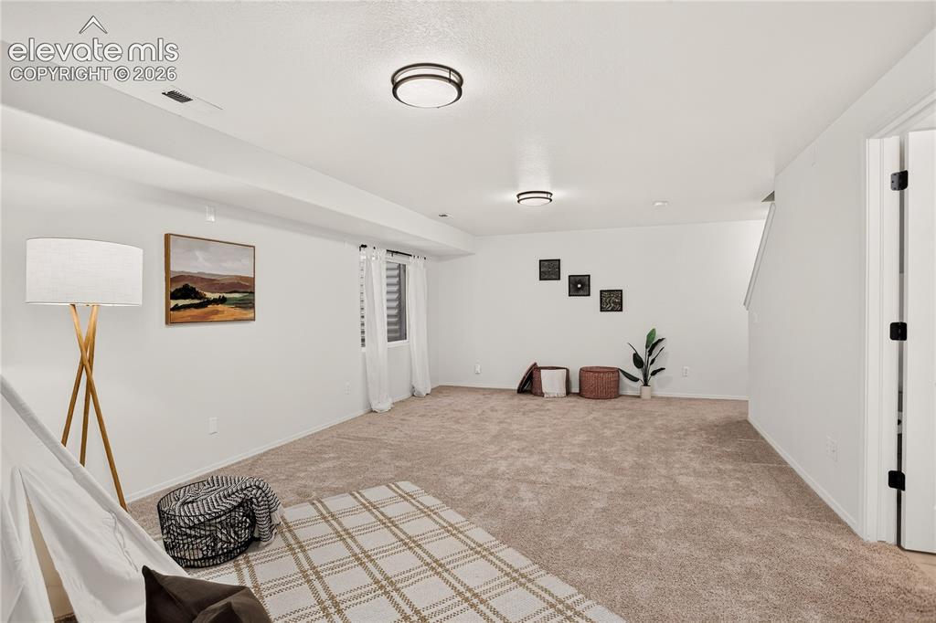 Image 6 of 35: Open space in basement for family room/entertaining.