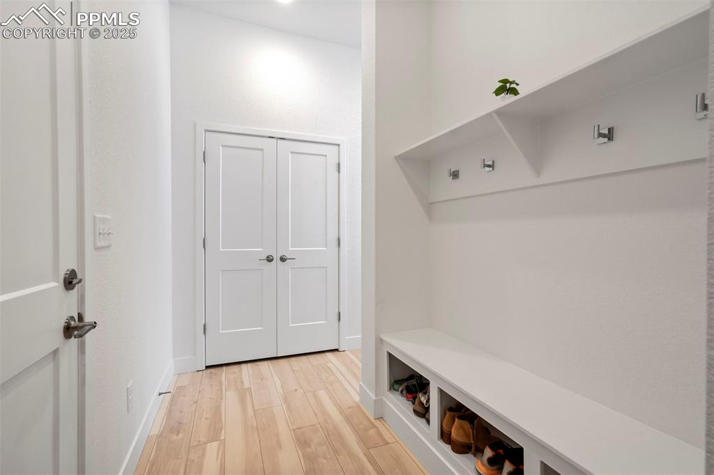 Image 15 of 45: Mudroom with light wood-style flooring and baseboards