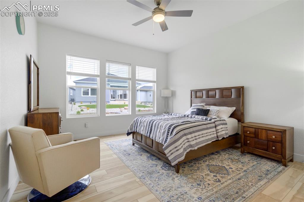 Image 26 of 45: Bedroom featuring light wood-style floors and a ceiling fan