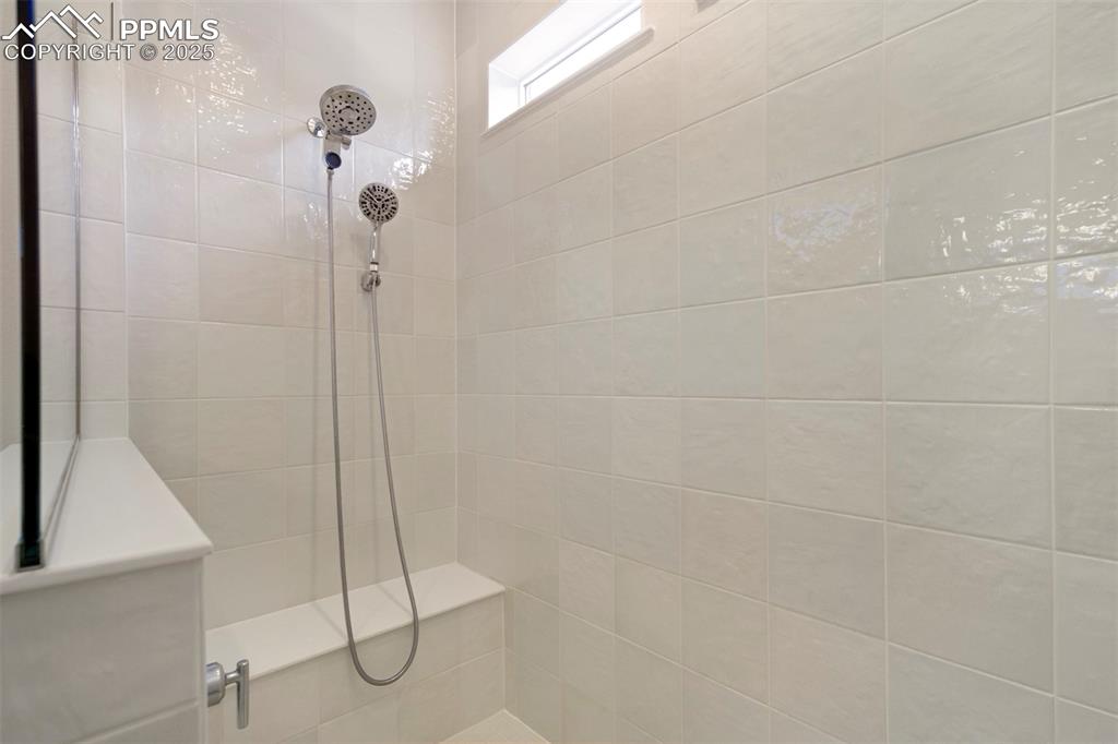 Image 31 of 45: Bathroom with tiled shower