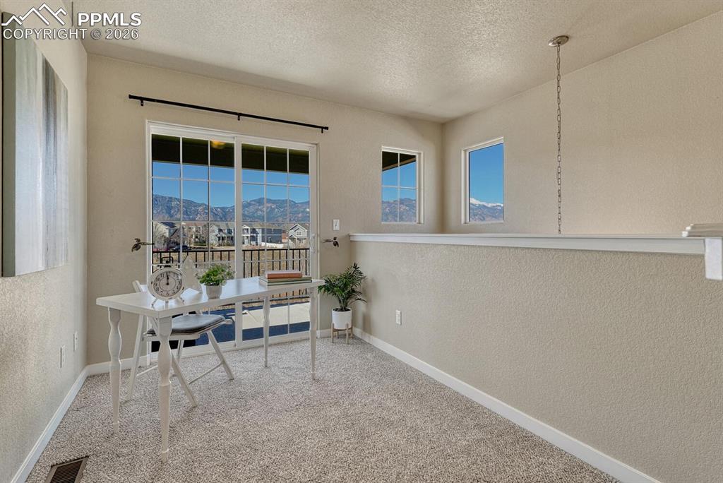 Image 17 of 50: Loft with Mountain Views and walk-out to balcony