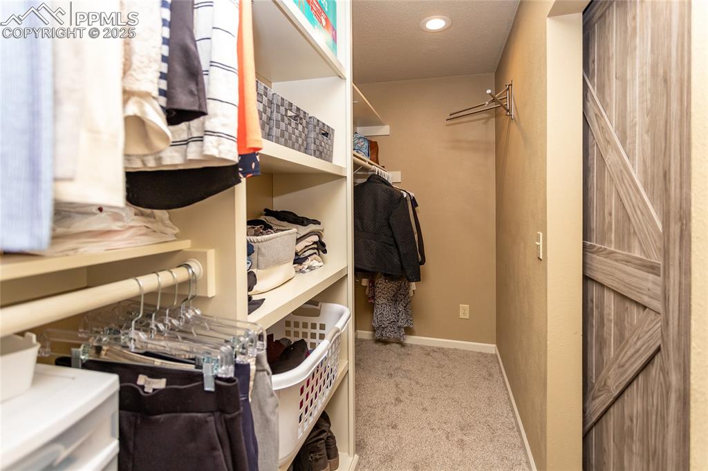 Image 20 of 43: Master Walk-in Closet