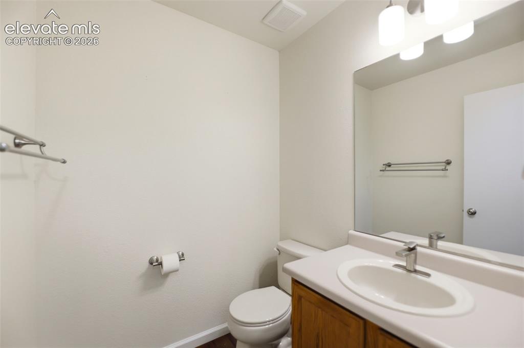 Image 11 of 32: Main level half bath