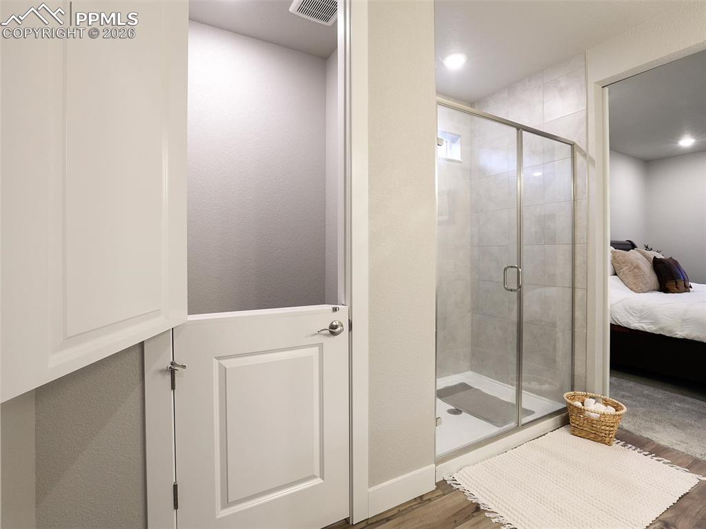 Image 30 of 47: flex space door shown- dog kennel, vanity area, more closet space