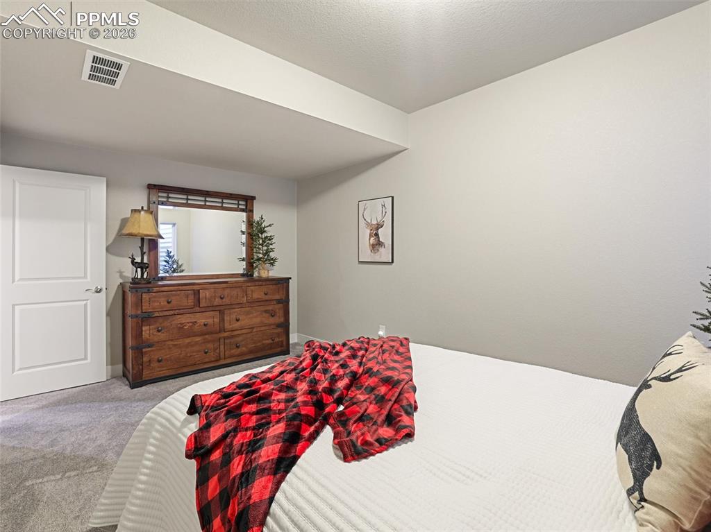 Image 34 of 47: basement bedroom