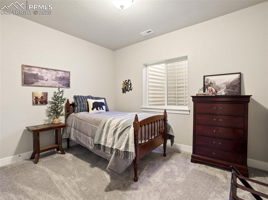 Image 36 of 47: basement bedroom